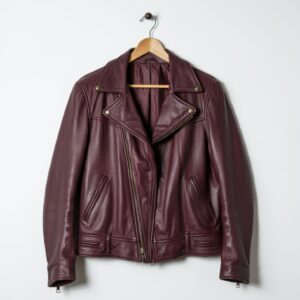 Elegant brandy color woman's leather jacket, photographed on ghost mannequin, isolated with white background. Front view.